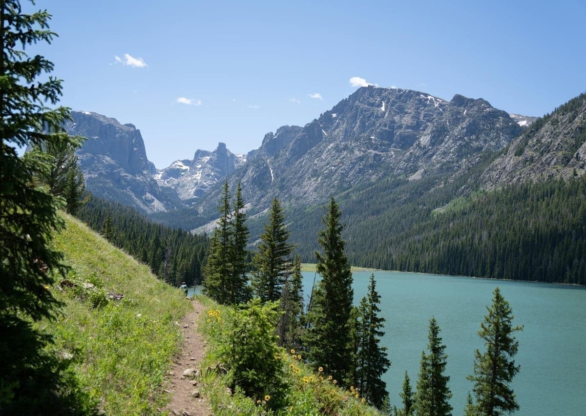 Green River Lakes with Squaretop Mountain rising above clear blue waters in Wyoming Wind River Range