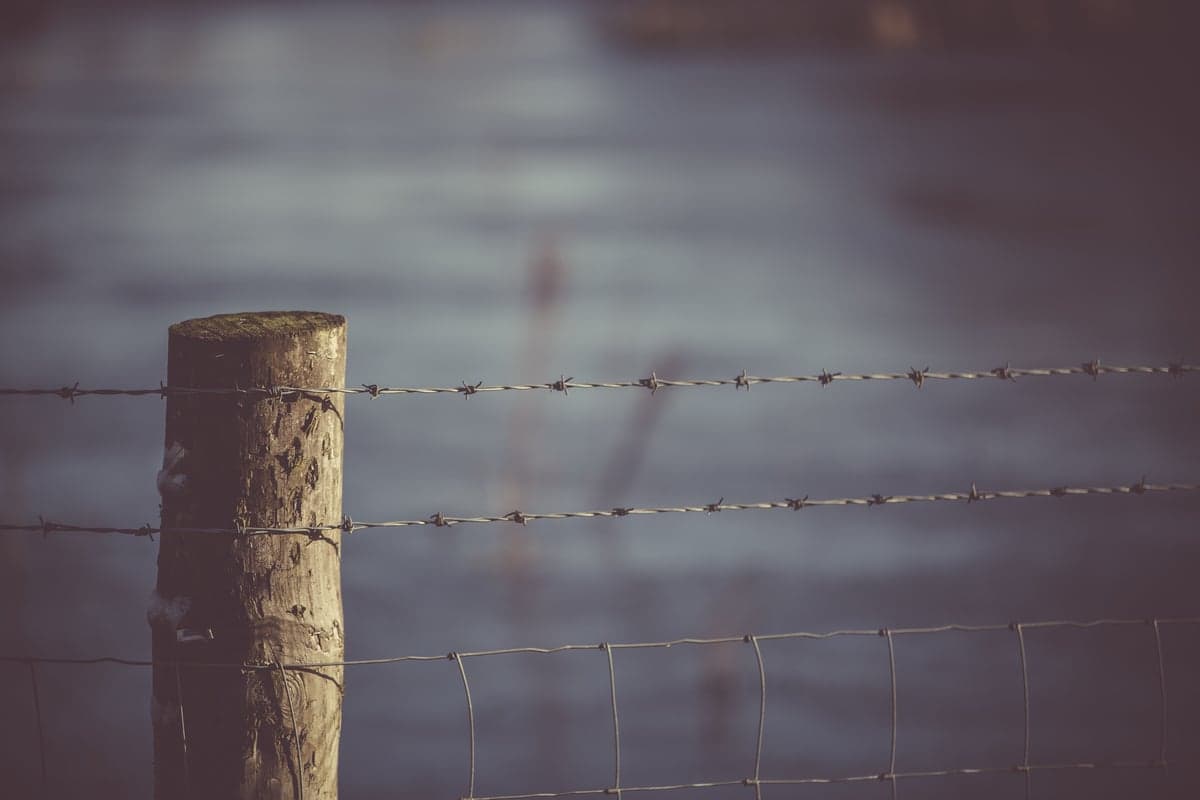Barbed wire across or alongside a river typically signals private property in Colorado
