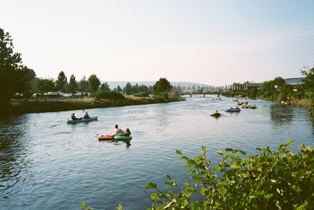 Paddlers on the Deschutes River near Bend. The upper river through town is a popular recreation corridor with a different character than the wild lower canyon.