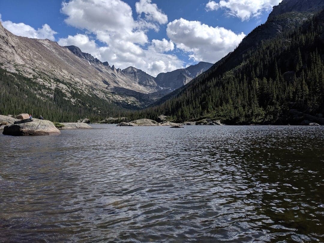 Wide river flowing through a mountain valley in Colorado
