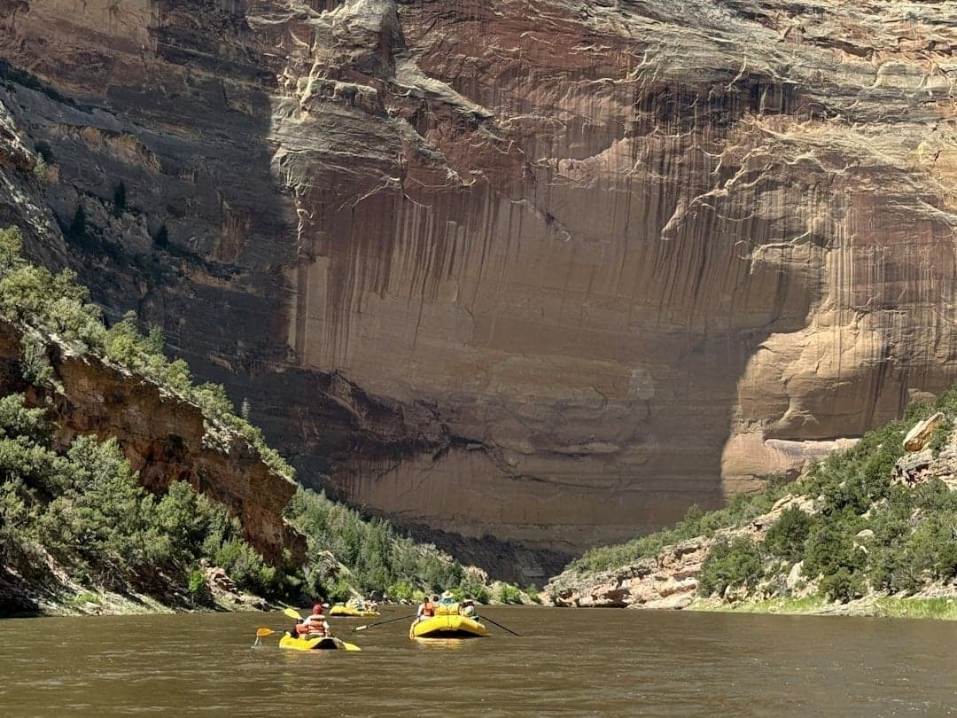 Rafters floating through canyon meanders on a Colorado river
