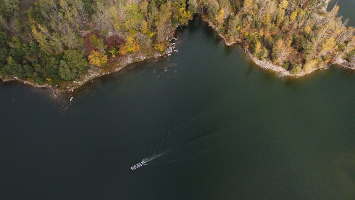 Aerial view of the Grand River in Grand Rapids, Michigan with vibrant fall foliage along the banks
